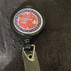 Black Badge Reel with Red and Purple Design